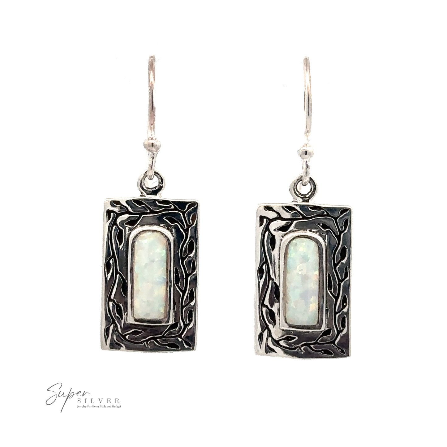 
                  
                    Rectangular sterling silver earrings with intricate designs surrounding oval-shaped, lab-created opal stones. "White Created Opal Square Earrings" brand logo visible in the lower-left corner.
                  
                