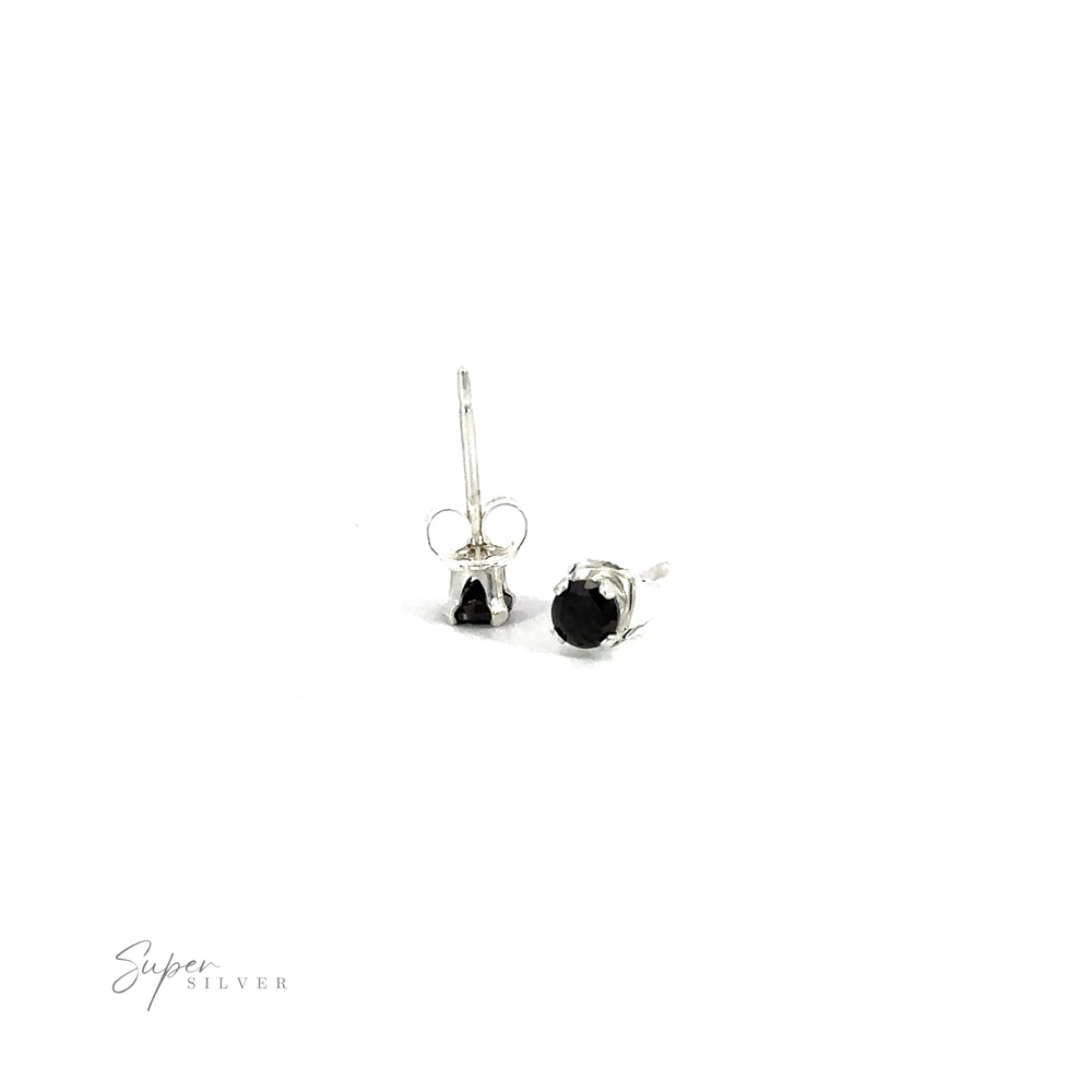
                  
                    Round CZ Studs with black cubic zirconia on a white background.
                  
                