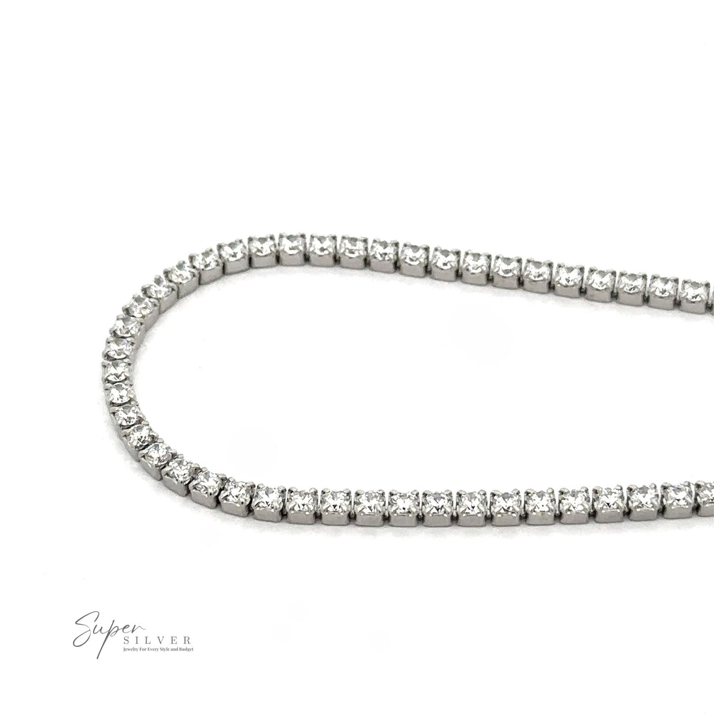 
                  
                    A silver necklace with a series of small, round gemstones set closely together, forming a partial loop on a white background. The image includes a small "Super Silver" logo in the bottom left corner, reminiscent of the elegance found in a Square Cubic Zirconia Tennis Bracelet.
                  
                