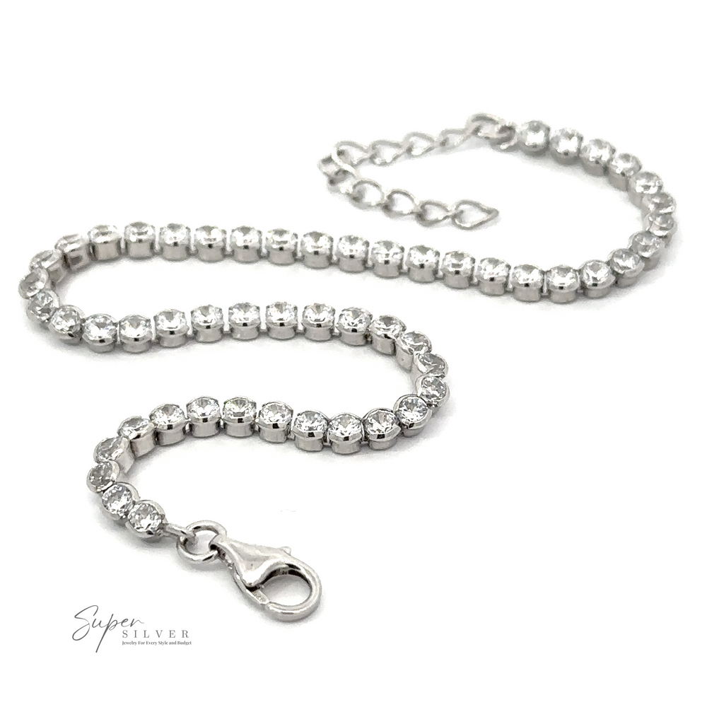 
                  
                    A stunning Round Cubic Zirconia Tennis Bracelet featuring round, clear gemstones and a lobster claw clasp, this rhodium plated piece is crafted from .925 sterling silver.
                  
                