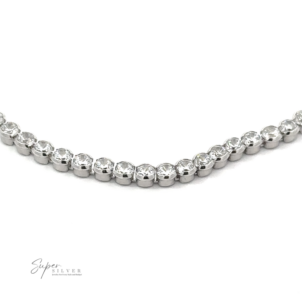 
                  
                    A close-up of a stunning Round Cubic Zirconia Tennis Bracelet showcases a row of round, clear gemstones set in .925 Sterling Silver. The bracelet is labeled "Super Silver" in the lower left corner, highlighting its exquisite craftsmanship.
                  
                