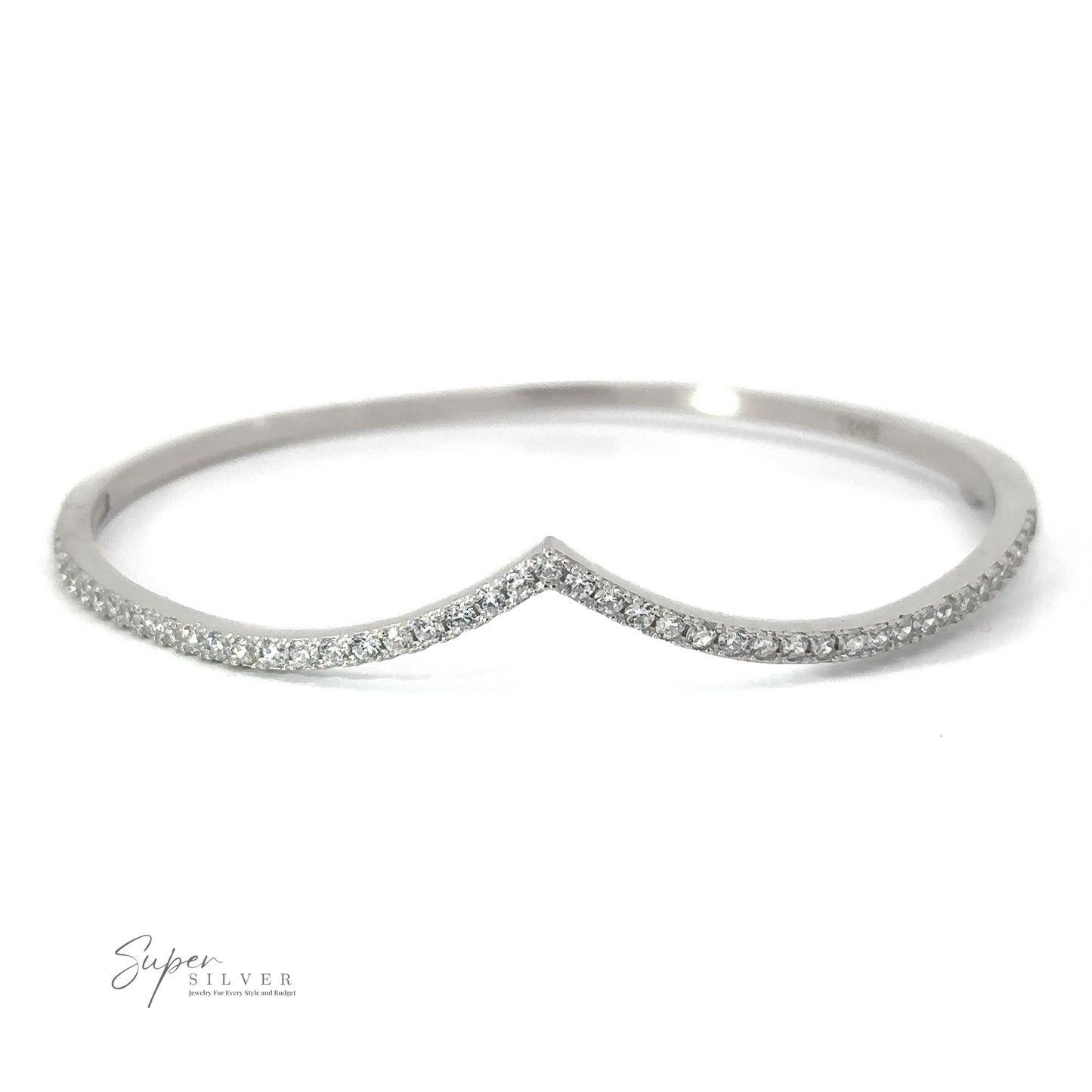 A silver, V-shaped bangle with a thin line of small, evenly distributed diamonds. The Cubic Zirconia Chevron Latch Bracelet has a minimalist design and appears delicate. The Rhodium Plated Sterling Silver adds an extra touch of elegance. The logo "Super Silver" is visible in the bottom left corner.