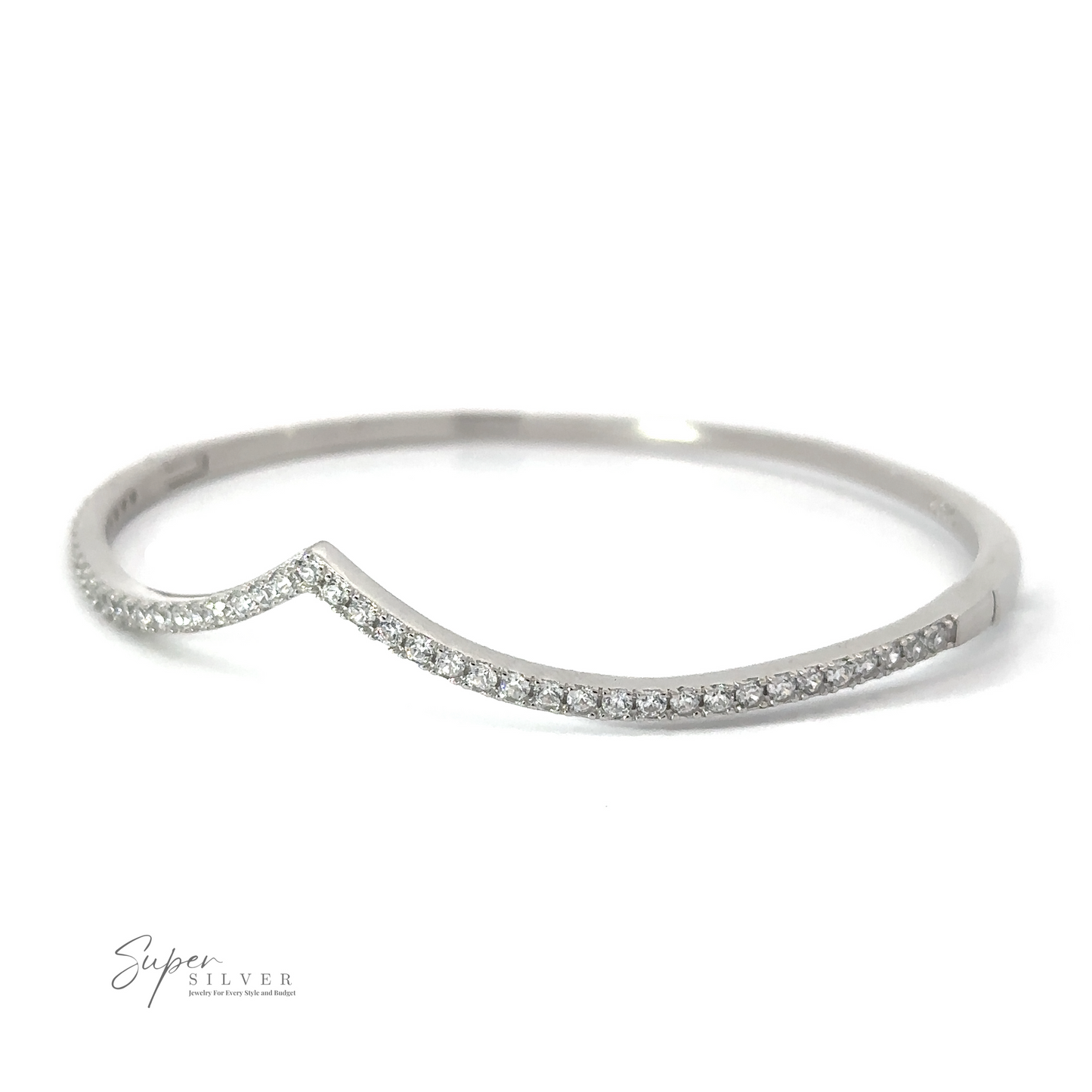 
                  
                    A silver bangle bracelet with a wavy, asymmetrical design and encrusted with small, sparkling gemstones exudes elegance. The Cubic Zirconia Chevron Latch Bracelet features the "Super Silver" branding in the lower left corner.
                  
                