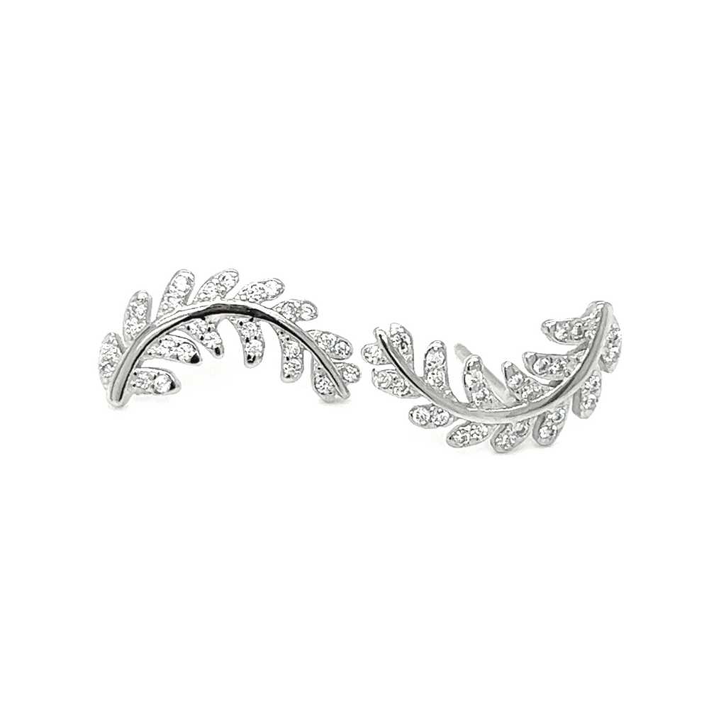 A pair of Curved Fern Leaf Cubic Zirconia Studs earrings with diamonds featuring a fern-inspired pattern from Super Silver.