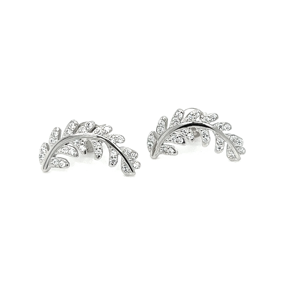 A pair of Super Silver Curved Fern Leaf Cubic Zirconia Studs with a fern-inspired pattern and curved shape.