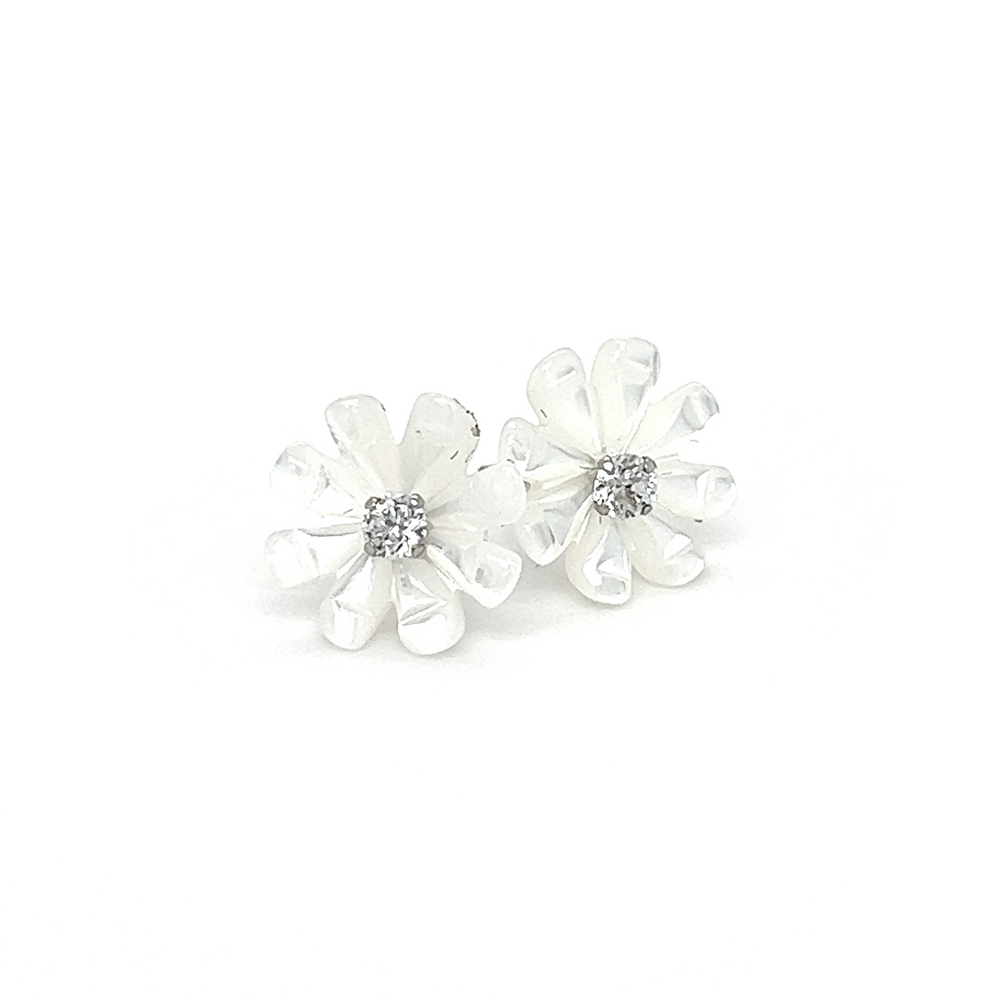A pair of Super Silver Mother of Pearl Flower with Cubic Zirconia Center Studs earrings adorned with diamonds.