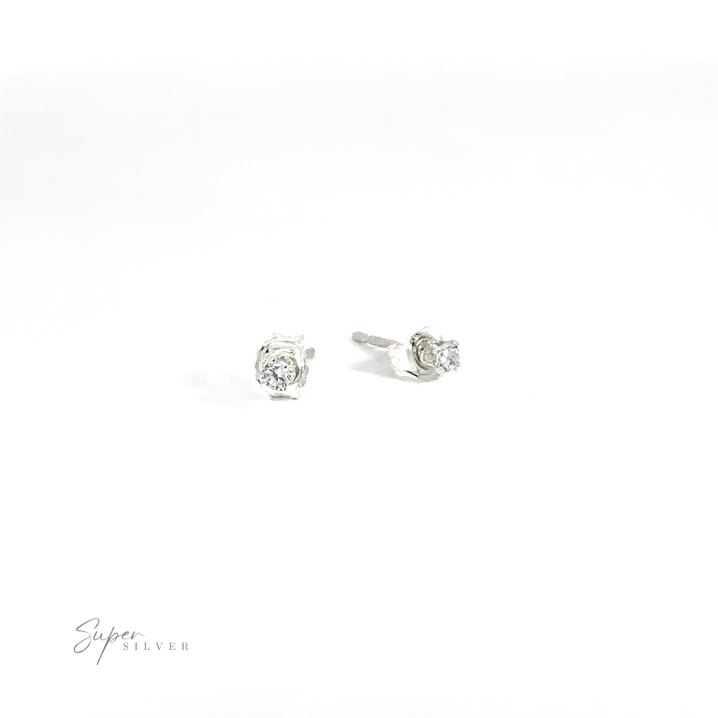 
                  
                    A pair of versatile Round CZ Studs with round, clear cubic zirconia gemstones on a white background.
                  
                