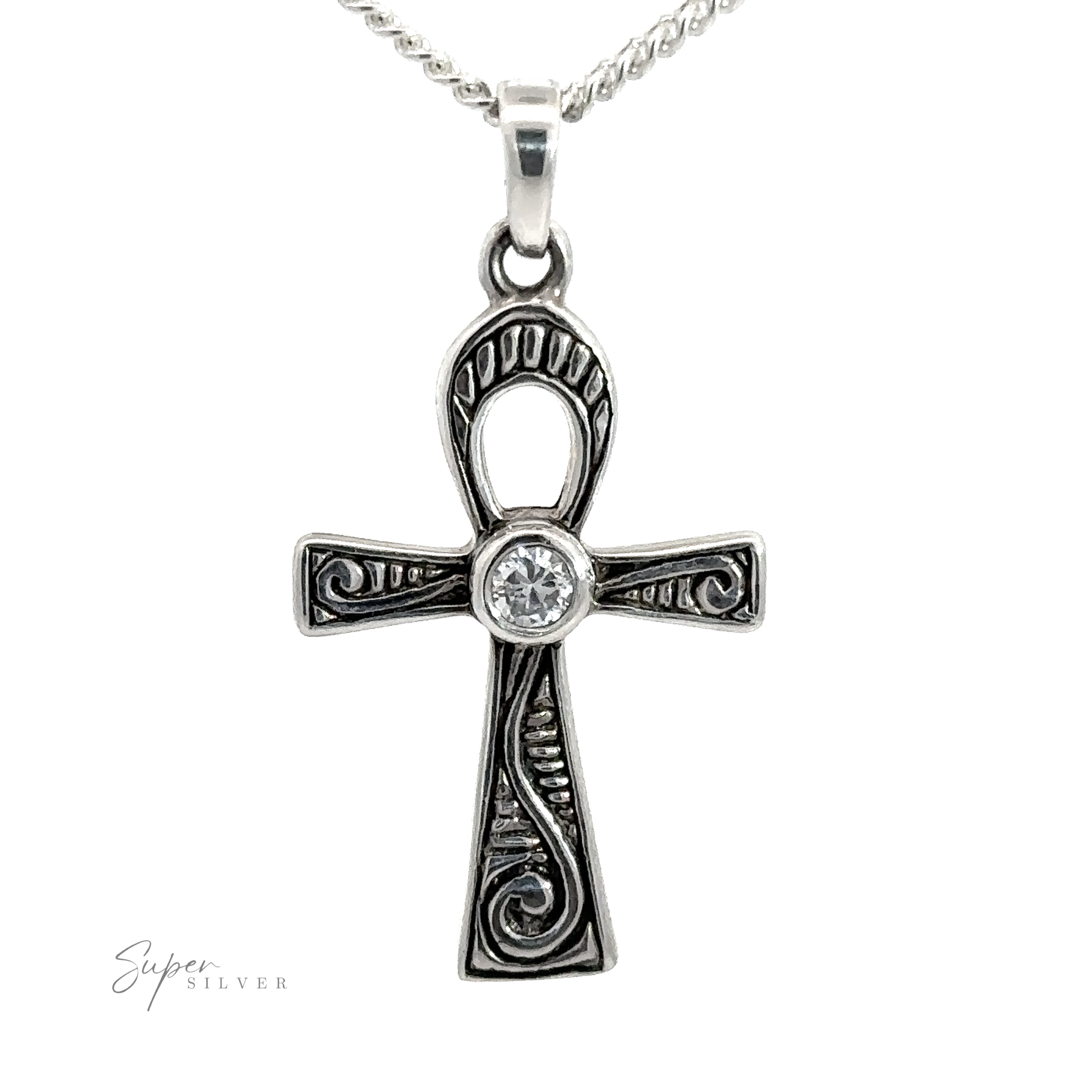 The Cubic Zirconia Ankh Pendant features engraved sterling silver details and a central round cubic zirconia gemstone, elegantly suspended on a silver chain.
