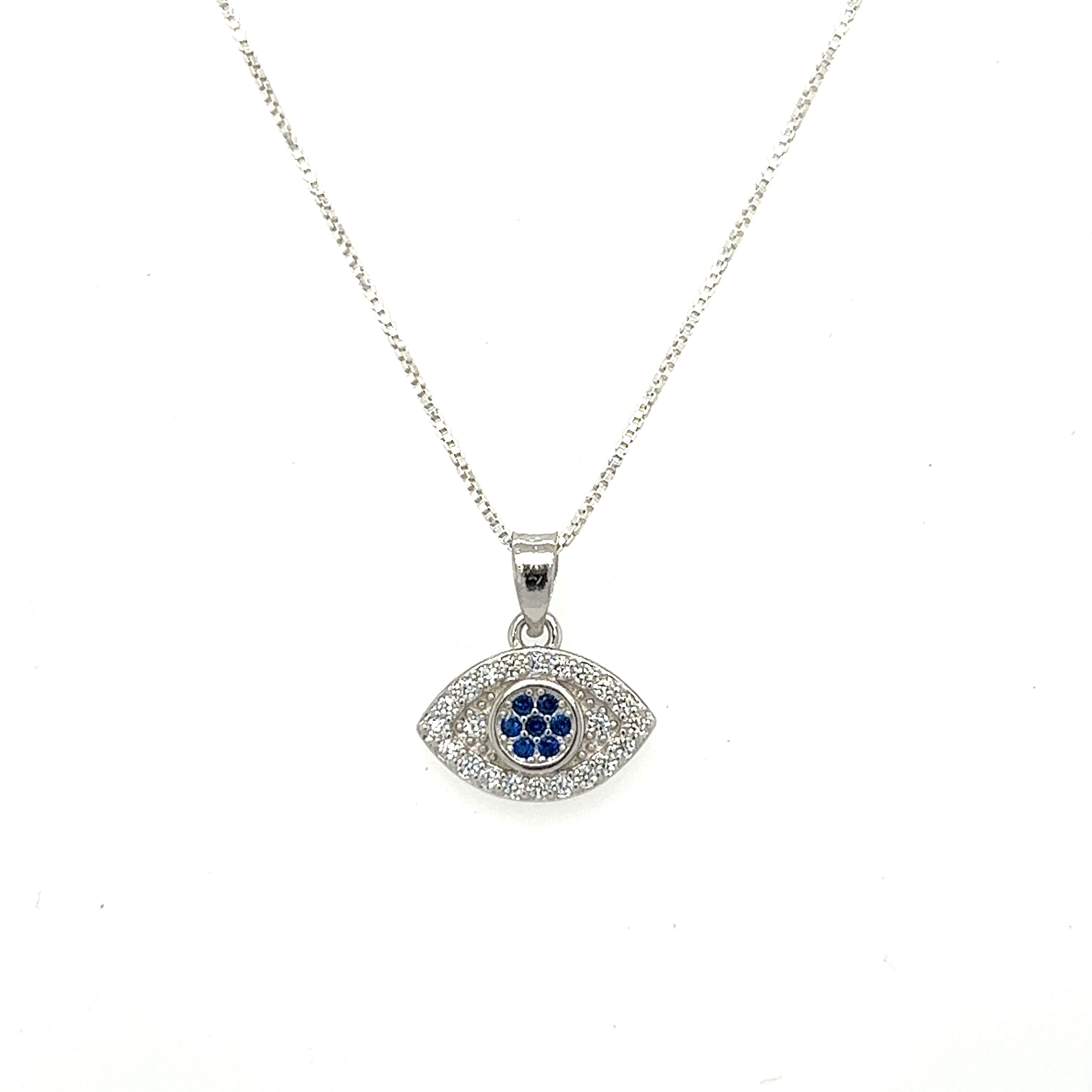 A stunning Evil Eye Pave Cubic Zirconia Charms pendant with vibrant blue stones, elegantly hanging from a sleek silver chain.