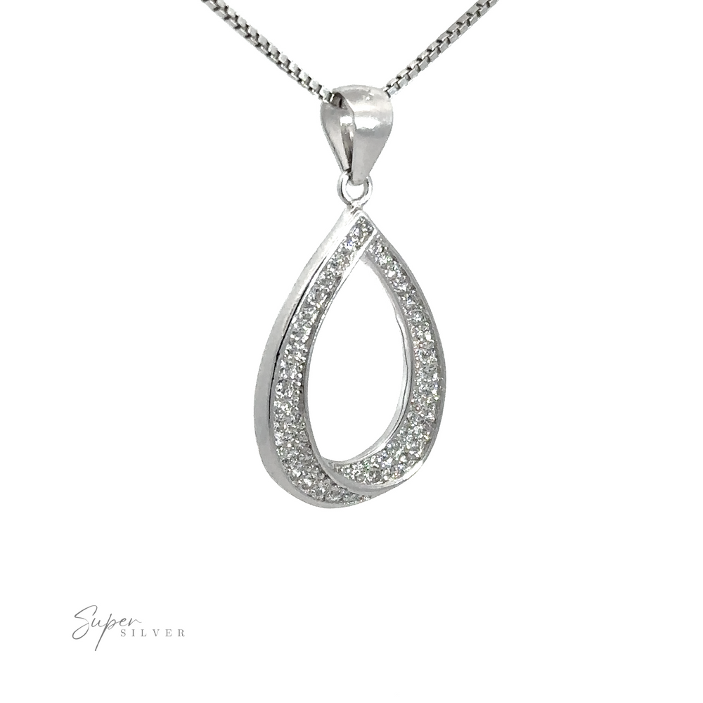 
                  
                    Teardrop Shape Cubic Zirconia Pendant with a sparkling, crystal-studded inner edge on a rhodium-plated sterling silver chain.
                  
                