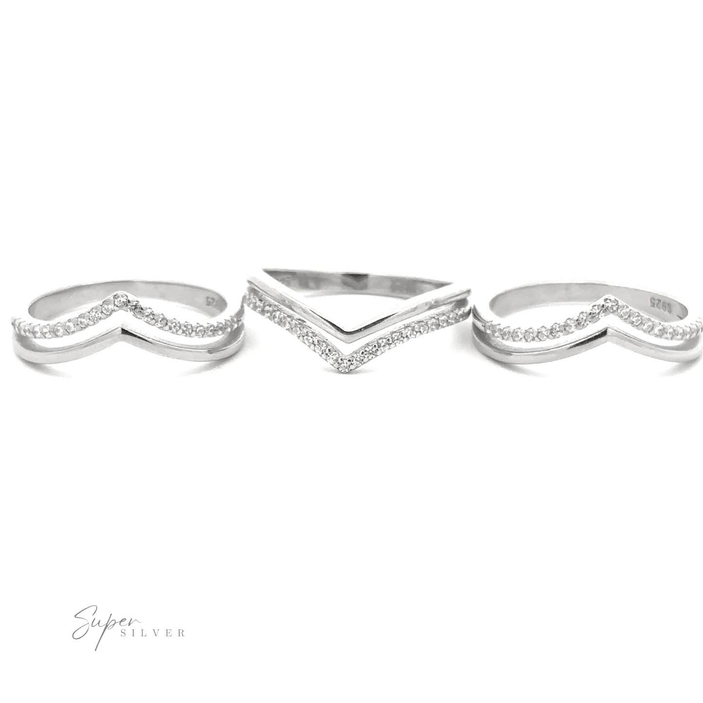 
                  
                    Three sterling silver rings with V-shaped designs; the middle ring features a plain band, while the other two have small cubic zirconia encrusted stones. Text in the image reads "Double Chevron Cubic Zirconia Ring.
                  
                