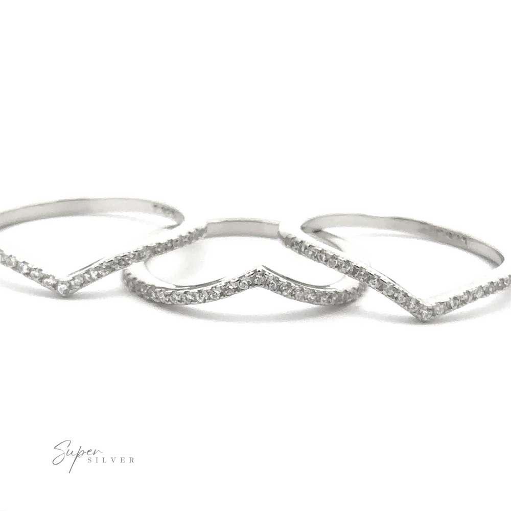 Three sterling silver Pave Cubic Zirconia Chevron Rings, featuring delicate pavé cubic zirconia stones in a minimal design, are arranged on a white background, exuding modern elegance. The logo "Super Silver" is visible in the corner.