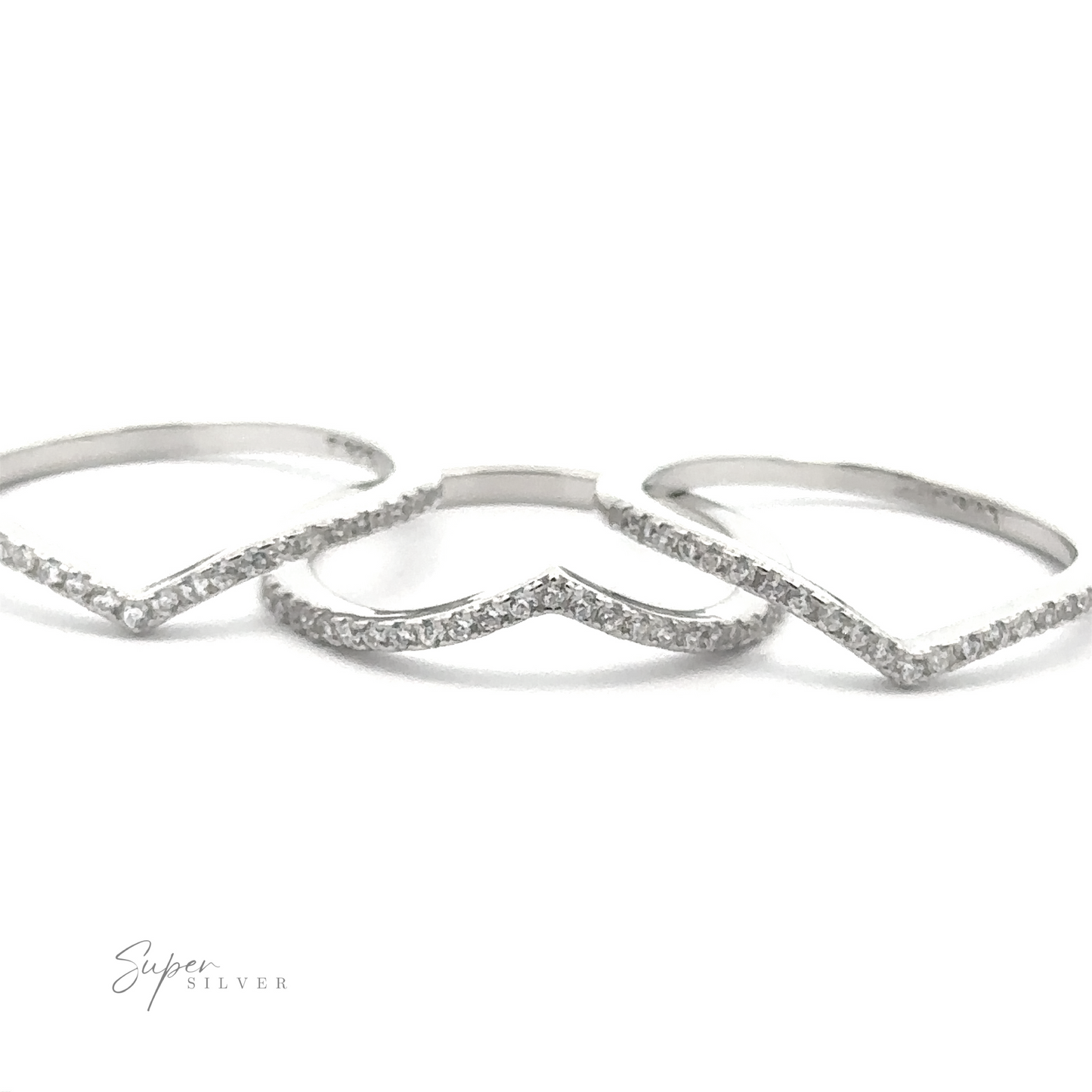 Three sterling silver Pave Cubic Zirconia Chevron Rings, featuring delicate pavé cubic zirconia stones in a minimal design, are arranged on a white background, exuding modern elegance. The logo "Super Silver" is visible in the corner.