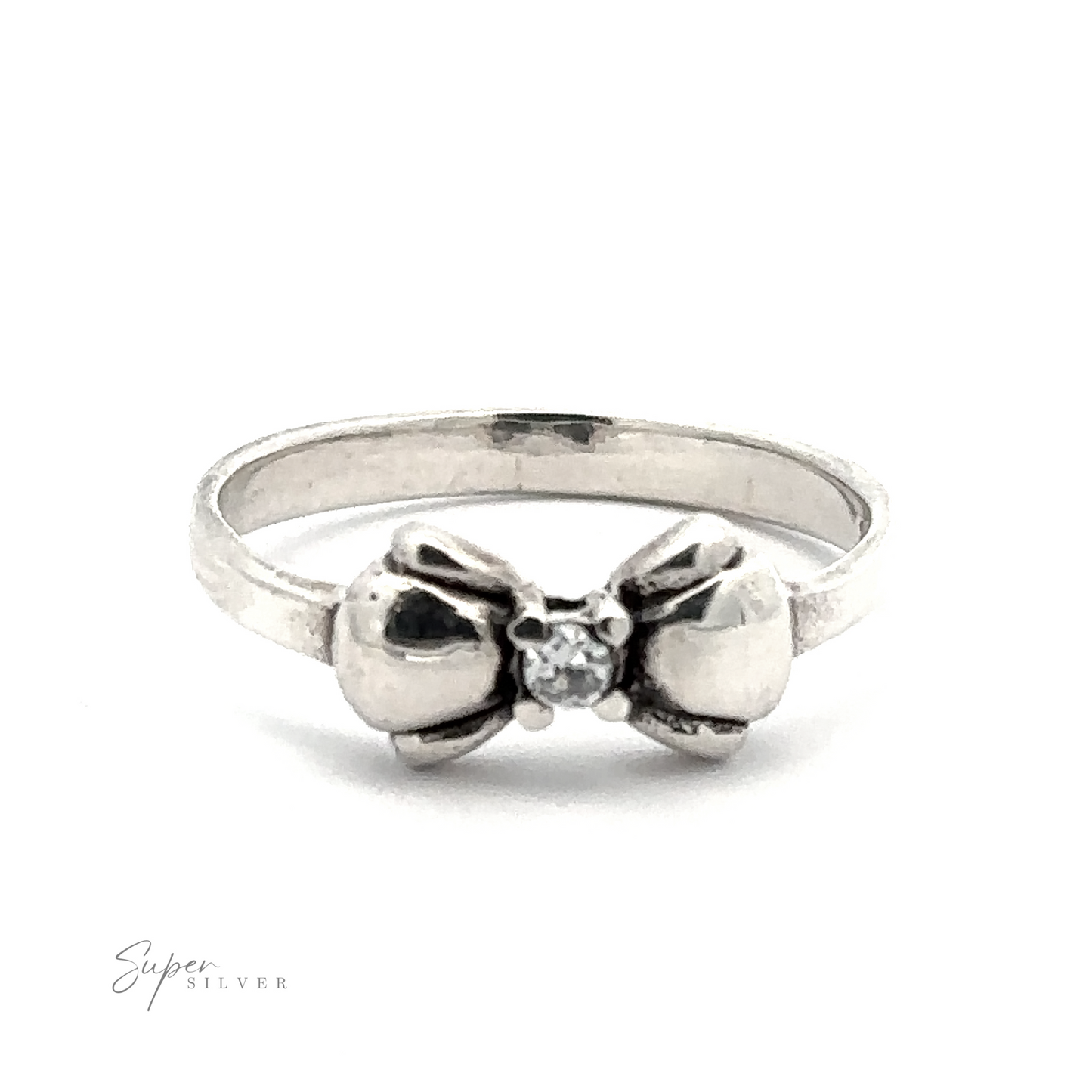 
                  
                    A sterling silver ring with a bow design and a small central black cubic zirconia gemstone. The bow is detailed, and the band is plain. The ring is labeled "Adorable Cubic Zirconia Bow Ring.
                  
                