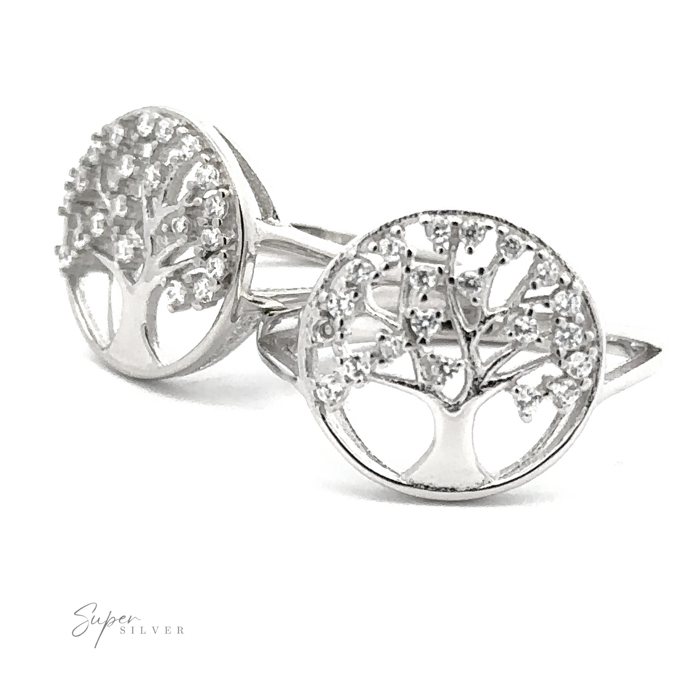 
                  
                    Two Tree Of Life Ring Cubic Zirconia Stones with intricate tree designs, adorned with delicate Cubic Zirconia stones, placed upright on a white background. The rings are labeled "Super Silver" in the corner.
                  
                