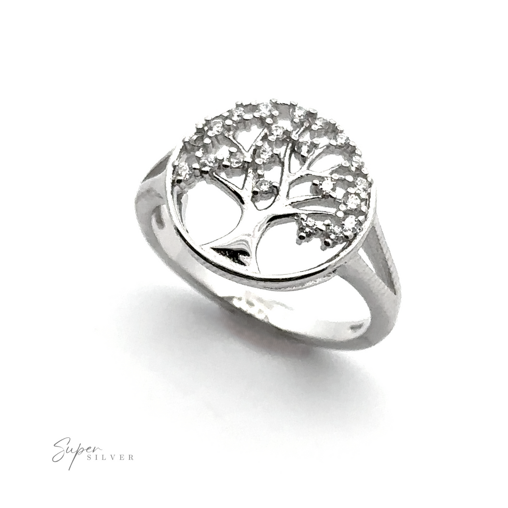
                  
                    A Tree Of Life Ring Cubic Zirconia Stones featuring a tree of life design with small Cubic Zirconia stones on the branches, displayed against a white background. The logo "Super Silver" is visible in the lower left corner.
                  
                