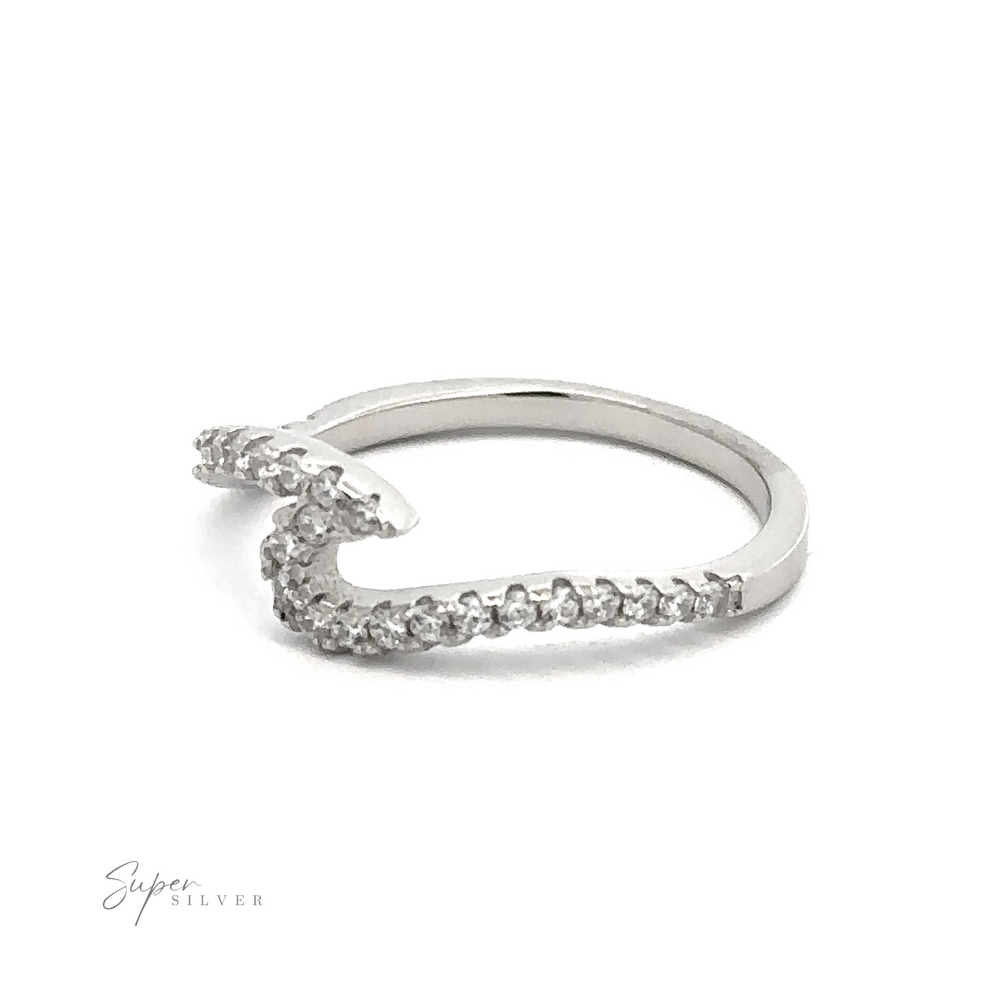 
                  
                    A sterling silver ring with a unique wavy design, adorned with small cubic zirconia gemstones. The Pave Wave Ring is placed against a plain white background. "Super Silver" is written in cursive at the bottom left corner.
                  
                