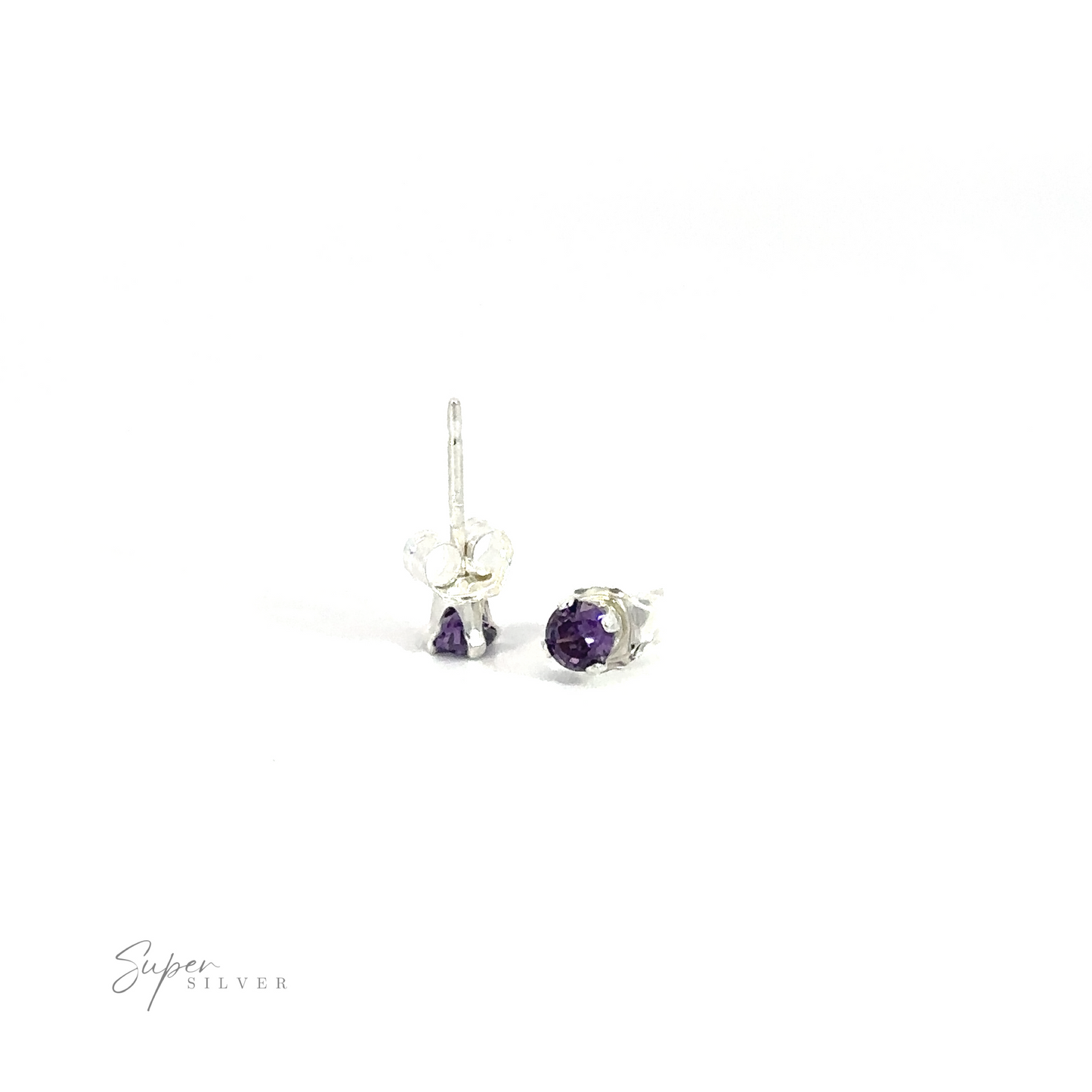 
                  
                    A pair of silver Round CZ Studs with purple cubic zirconia on a white background.
                  
                