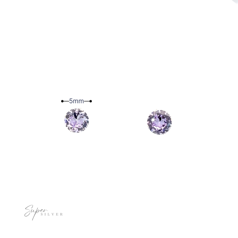 
                  
                    Two Round CZ Studs displayed against a white background.
                  
                