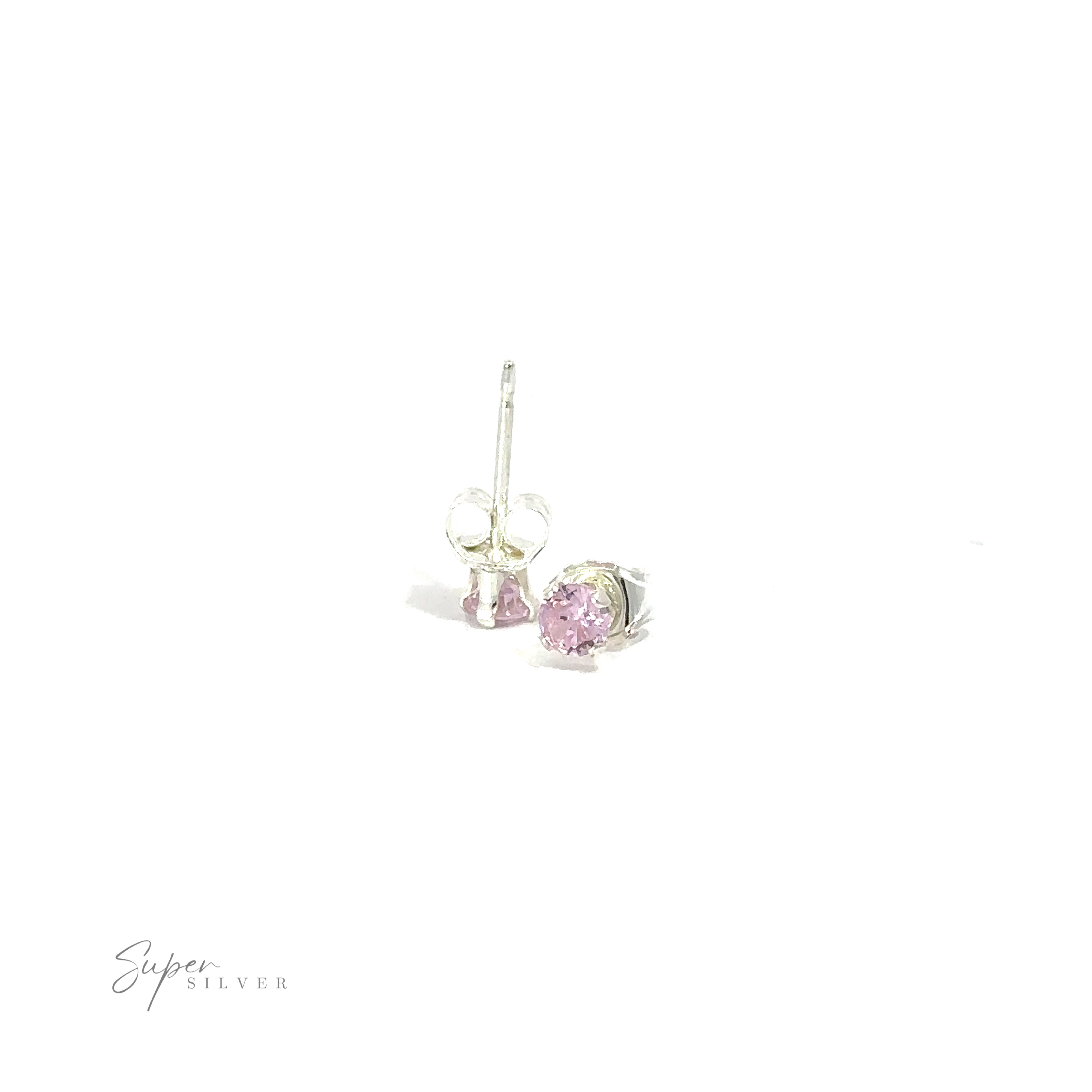 A pair of silver round CZ studs with pink cubic zirconia gemstones on a white background.