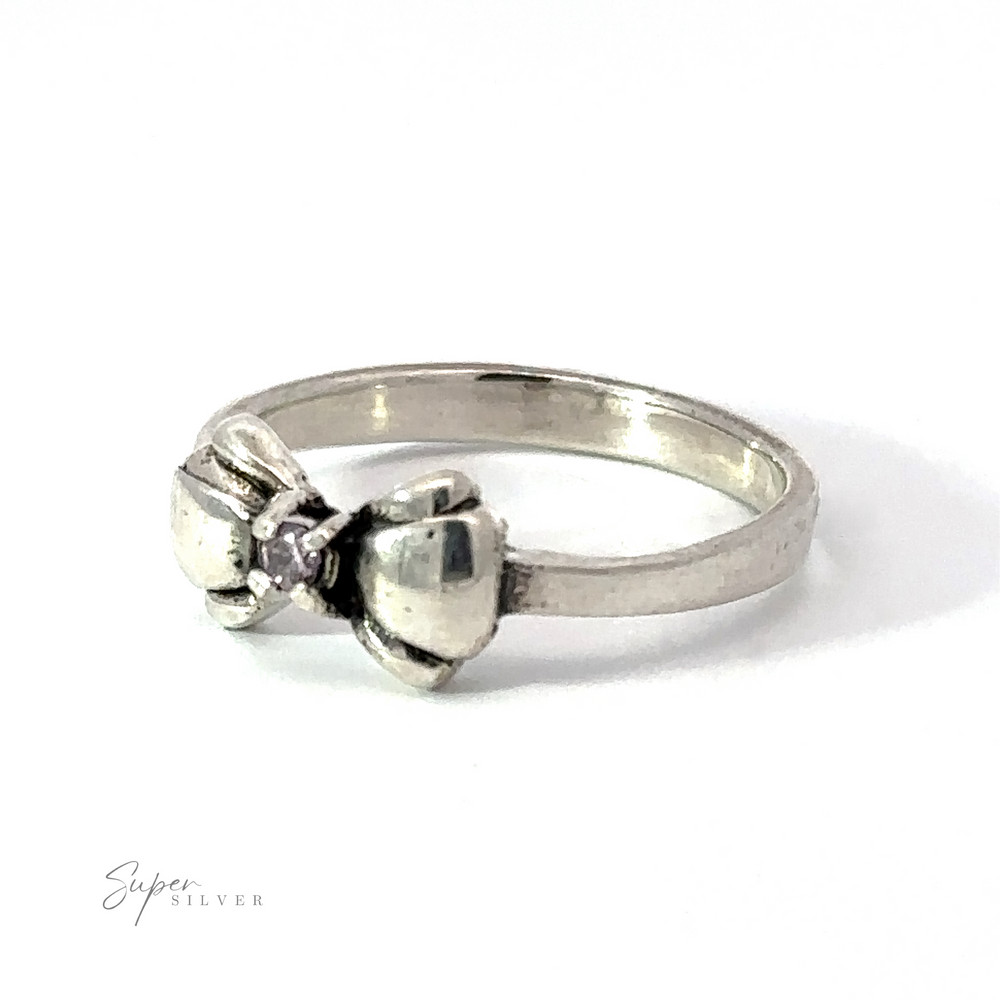 
                  
                    An Adorable Cubic Zirconia Bow Ring adorned with a black cubic zirconia at its center. The brand name, "Super Silver," is elegantly displayed in the bottom left corner of the image.
                  
                