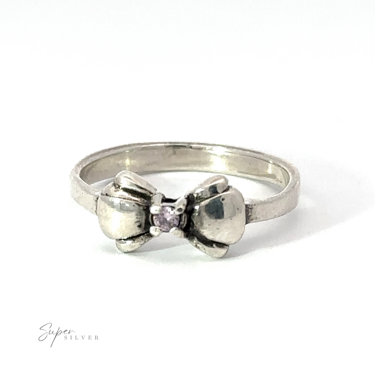 
                  
                    A sterling silver Adorable Cubic Zirconia Bow Ring featuring a small central black cubic zirconia, designed with two bow-like shapes on either side of the stone. Text in the corner reads "Super Silver.
                  
                