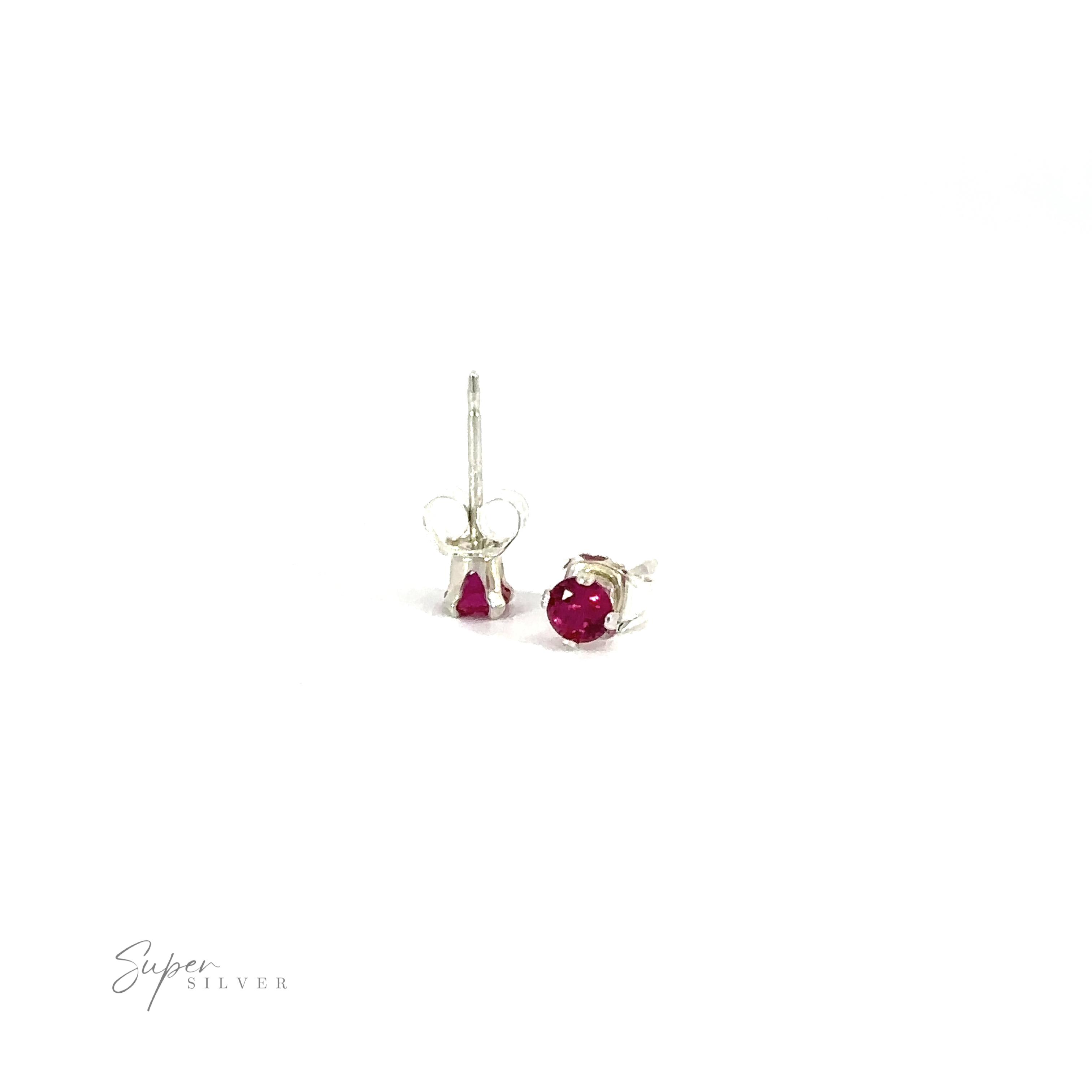 Round CZ Studs with purple cubic zirconia gemstones on white background.