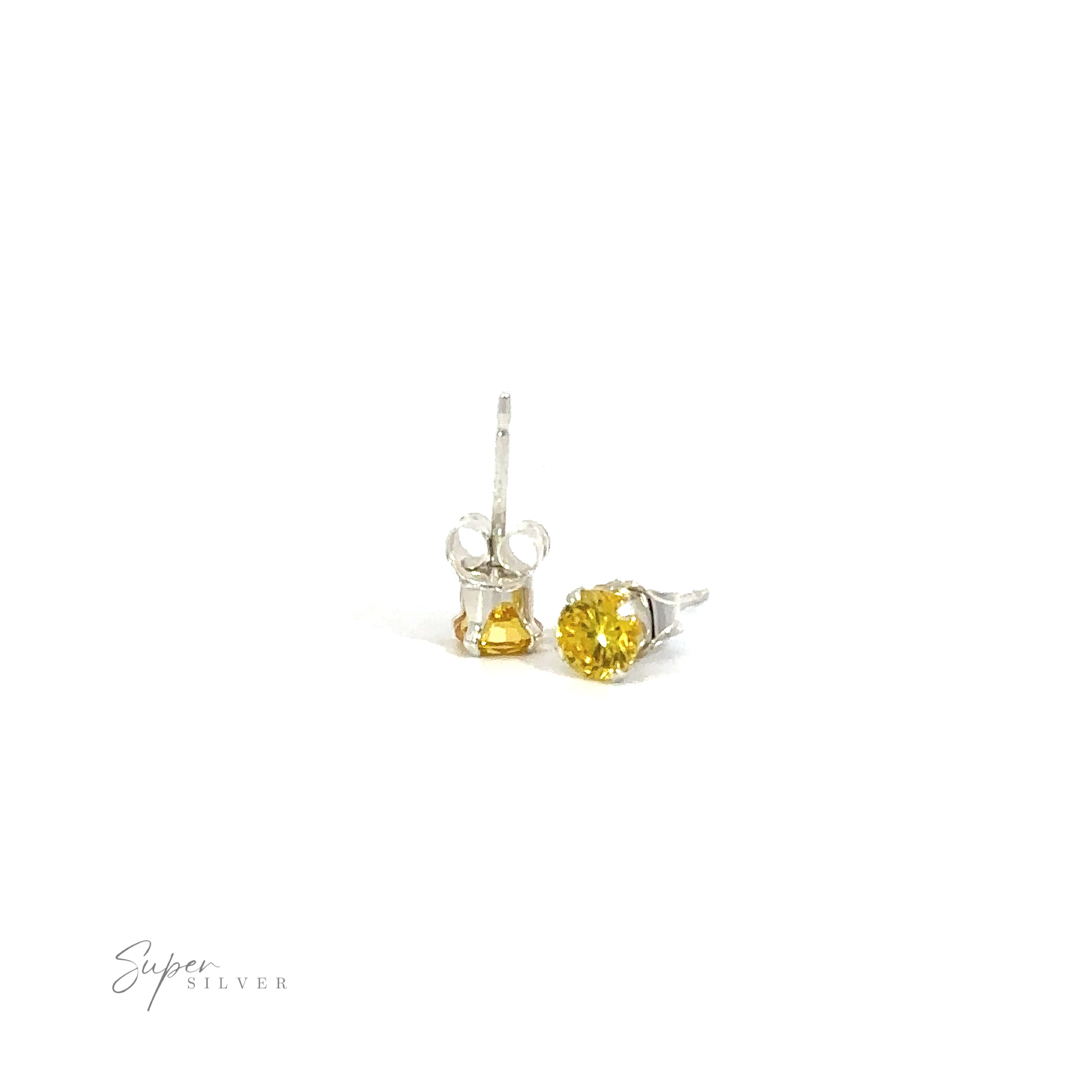 A pair of Round CZ Studs with yellow cubic zirconia on a white background.