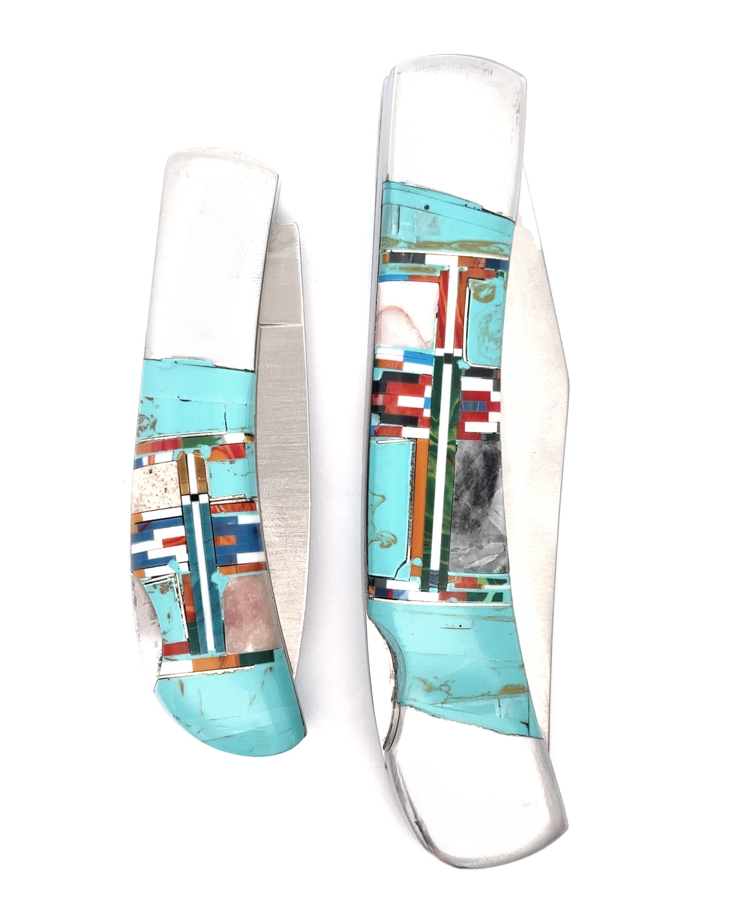 
                  
                    Two Intricate Inlay Southwest Pocket knives display detailed turquoise, red, blue, and white inlaid designs on their handles, capturing a unique Southwest style against a white background. One knife is open while the other remains closed.
                  
                