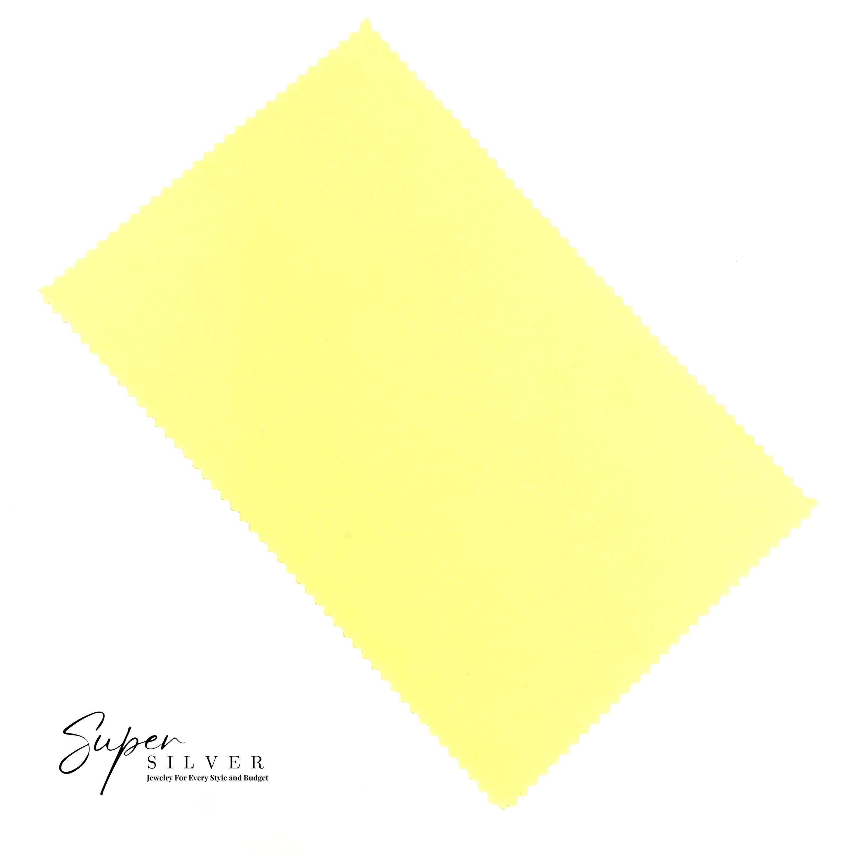 A rectangular yellow Polishing Cloth with zigzag edges lies on a white background, with "Super Silver CHANGES" printed in the bottom left corner.