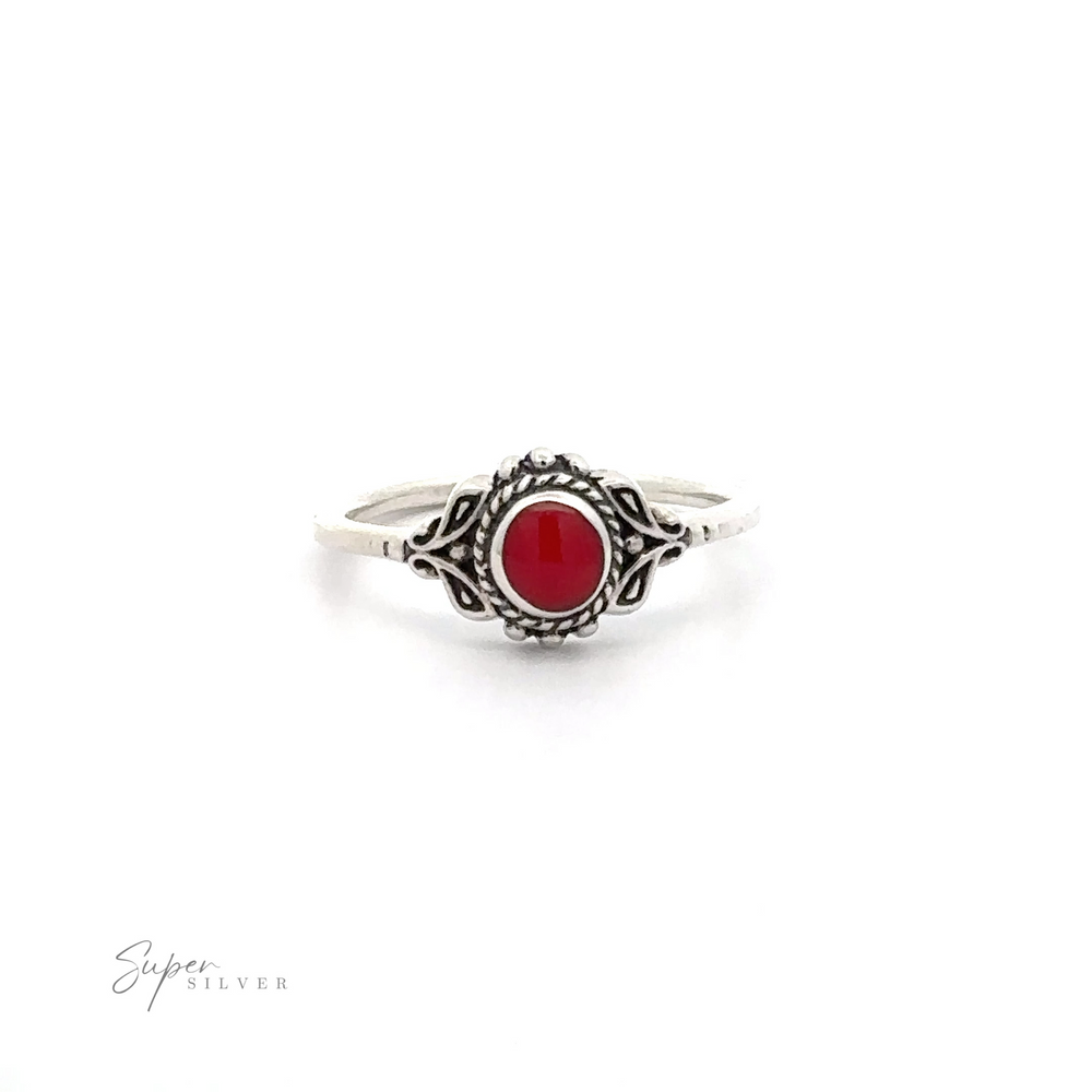 
                  
                    A Dainty Inlaid Stone Ring with Filigree with a red stone.
                  
                