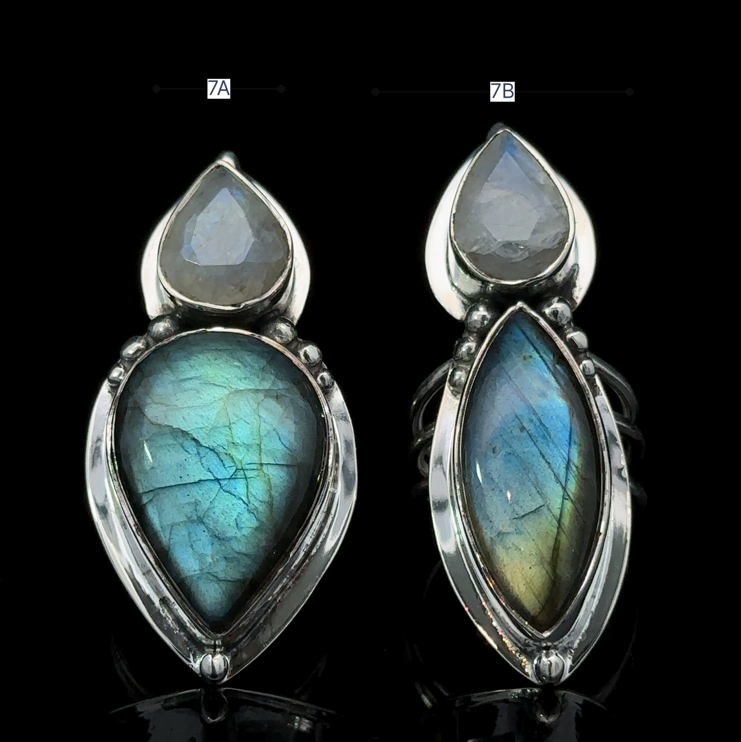 
                  
                    Two stunning Heavy Labradorite and Moonstone Rings, featuring teardrop-shaped labradorite and moonstone gemstones, are beautifully displayed against a black background.
                  
                