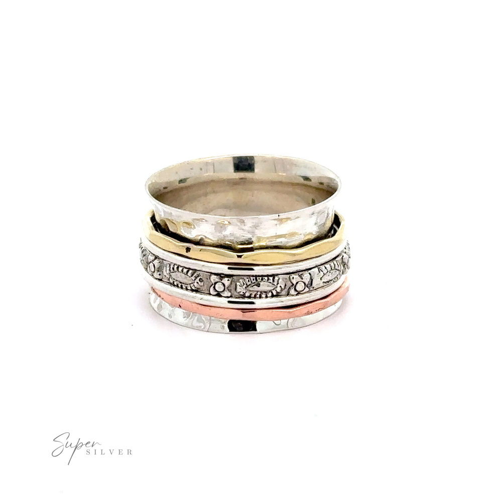 A stack of Tricolor Handmade Spinner Rings with A Flower Pattern Band on a white background.