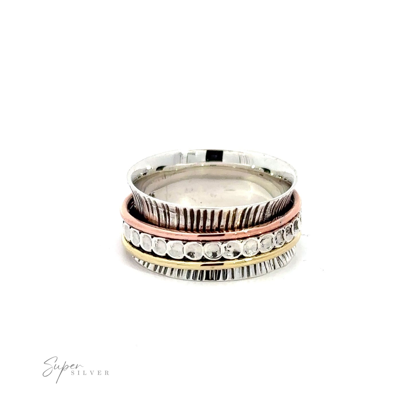 A stack of Handmade Tricolor Etched Spinner Rings on a white background.