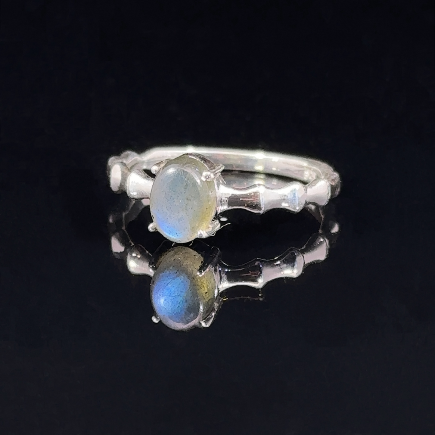 
                  
                    Pronged Oval Moonstone Ring with Textured Band
                  
                