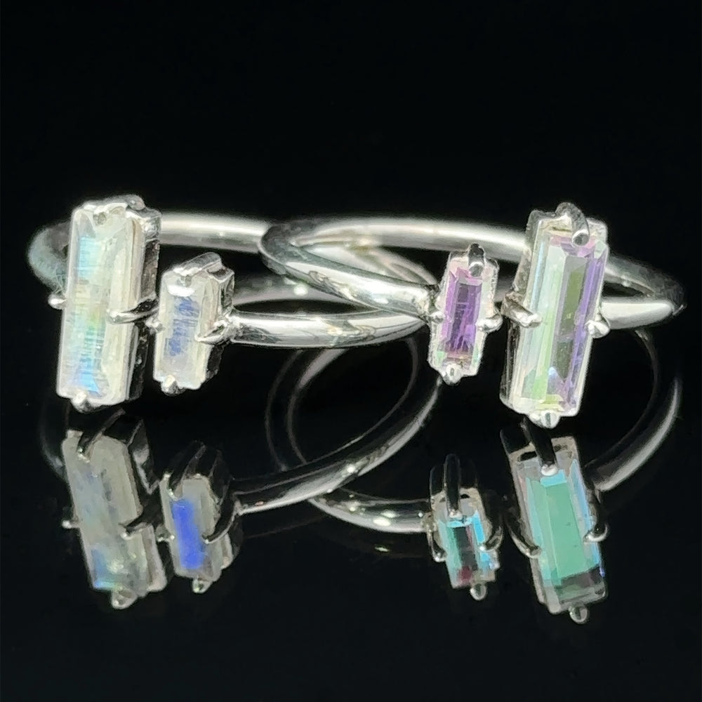 Online Only Exclusive Adjustable Crystal Ring featuring multicolored rectangular aurora crystals with a reflective black background.