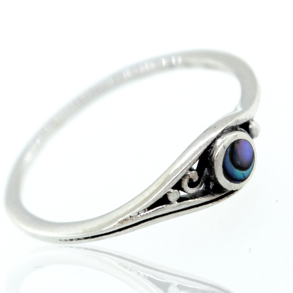 
                  
                    A sterling silver ring with the Delicate Inlay Stone Ring with Small Swirl Design.
                  
                