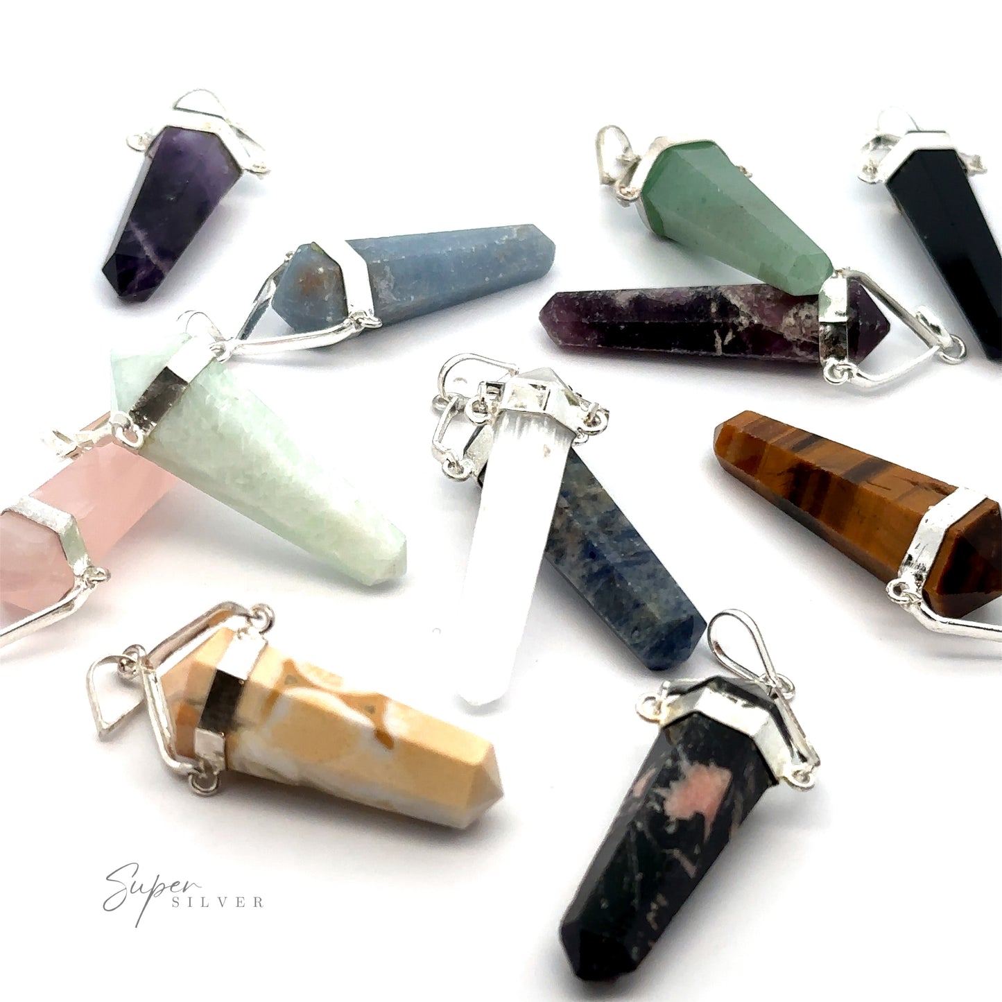 
                  
                    A collection of Raw Stone Swivel Pendants in various colors, each with silver-plated settings and loops for attaching to chains, displayed against a white background.
                  
                