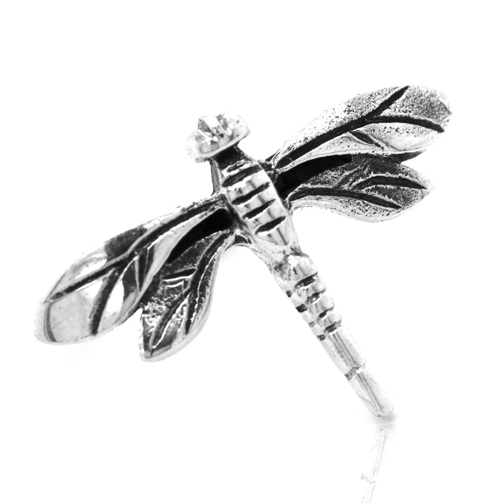 A Brilliant Silver Dragonfly Ring with fluttering wings.