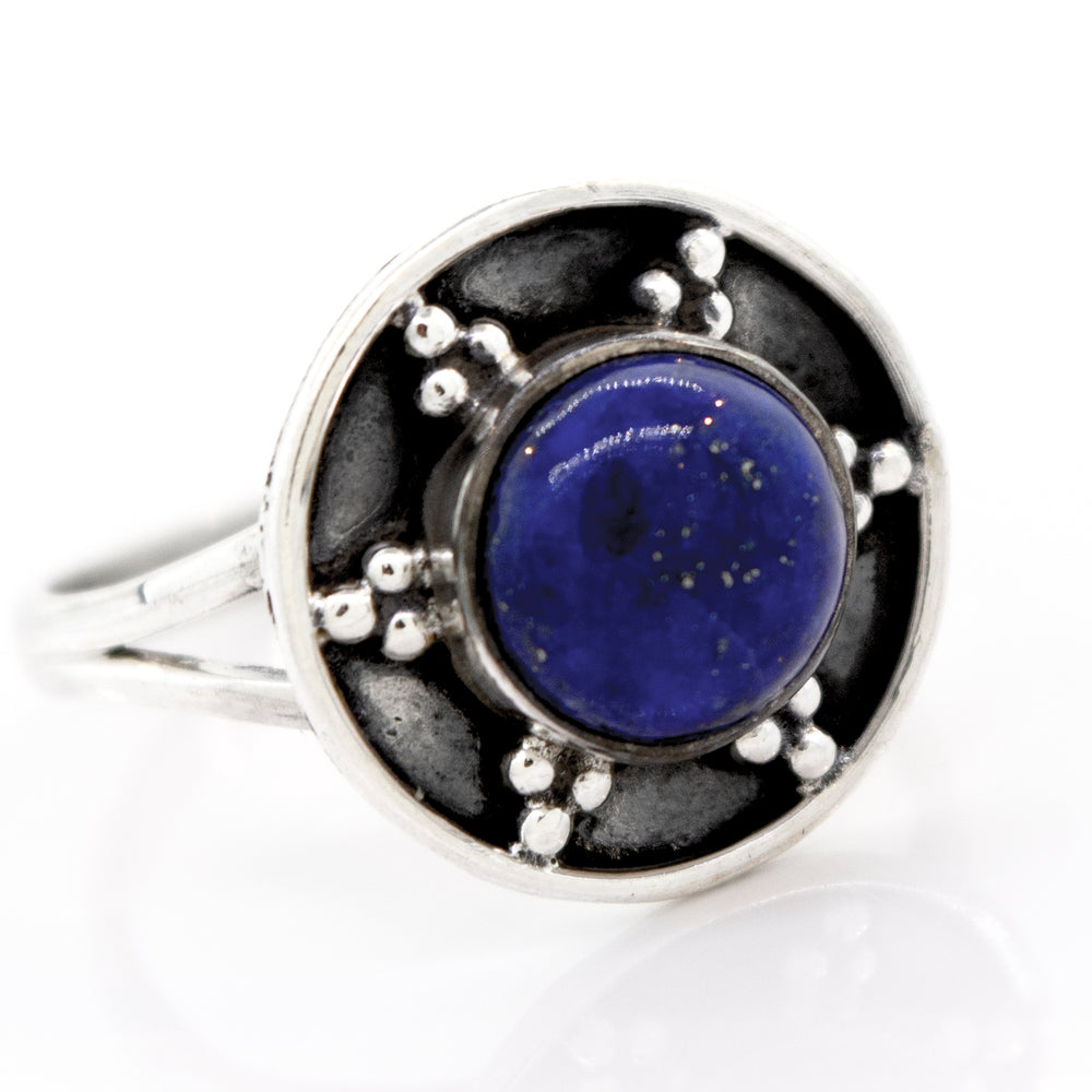 
                  
                    Gemstone Ring With Unique Oxidized Design, featuring a circular blue lapis lazuli centerpiece and oxidized silver bead accents around the stone.
                  
                
