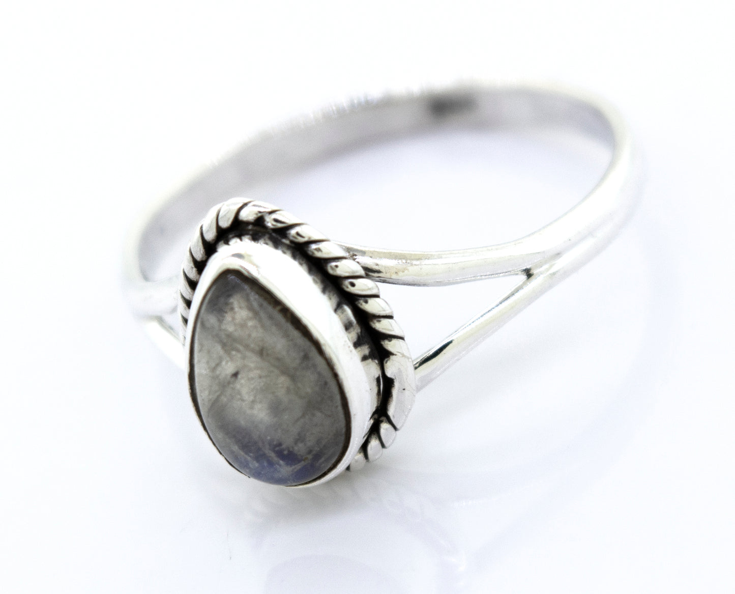 
                  
                    Vibrant Teardrop Shape Stone Ring with an oval gray gemstone set in a decorative bezel, displayed on a white background.
                  
                