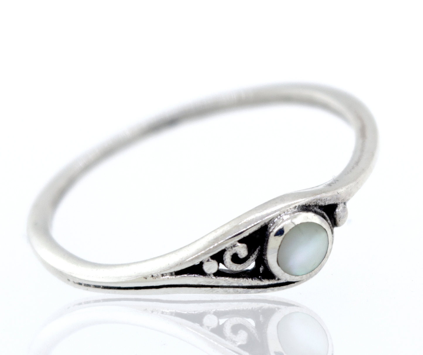 
                  
                    A Delicate Inlay Stone Ring with Small Swirl Design with inlaid mother of pearl.
                  
                
