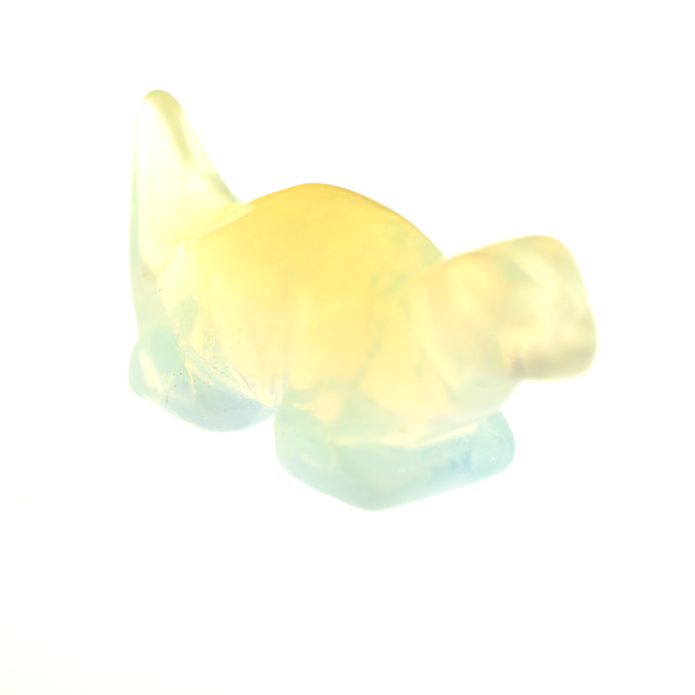 A small, translucent Carved Dinosaur Gemstone Figure in yellow and light blue colors against a white background.
