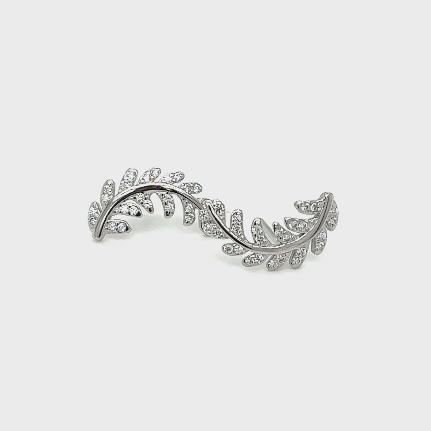 
                  
                    Load and play video in Gallery viewer, Curved Fern Leaf Cubic Zirconia Studs
                  
                