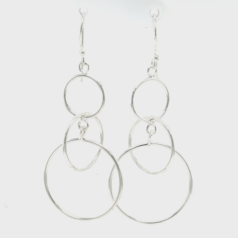
                  
                    Load and play video in Gallery viewer, Interlocked Circles Earrings
                  
                