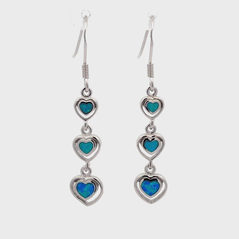 
                  
                    Load and play video in Gallery viewer, Dangling Lab-Created Opal Heart Earrings
                  
                