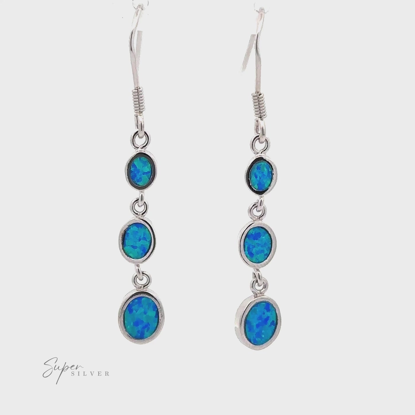 
                  
                    Charger et lire la vidéo dans la visionneuse de la galerie, Long Oval Blue Lab-Created Opal Earrings
                  
                