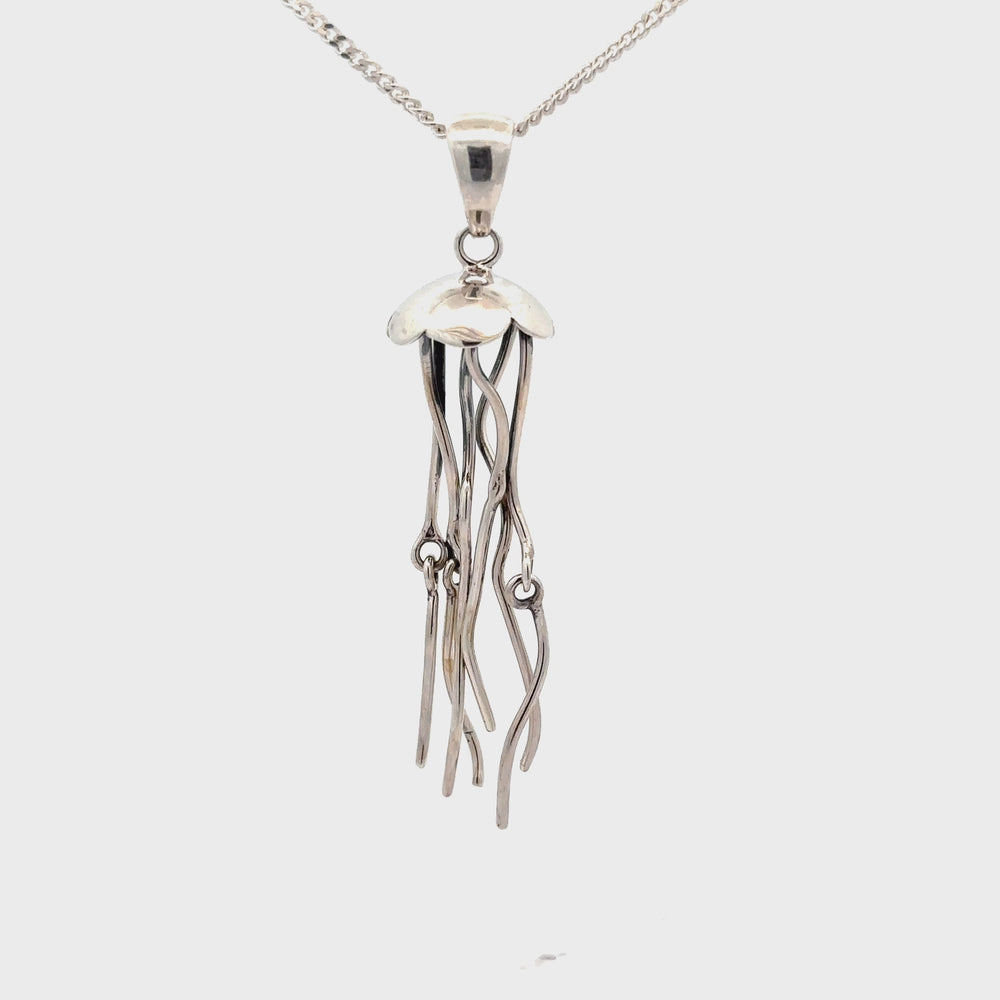 
                  
                    Load and play video in Gallery viewer, Moving Tentacle Jellyfish Pendant
                  
                