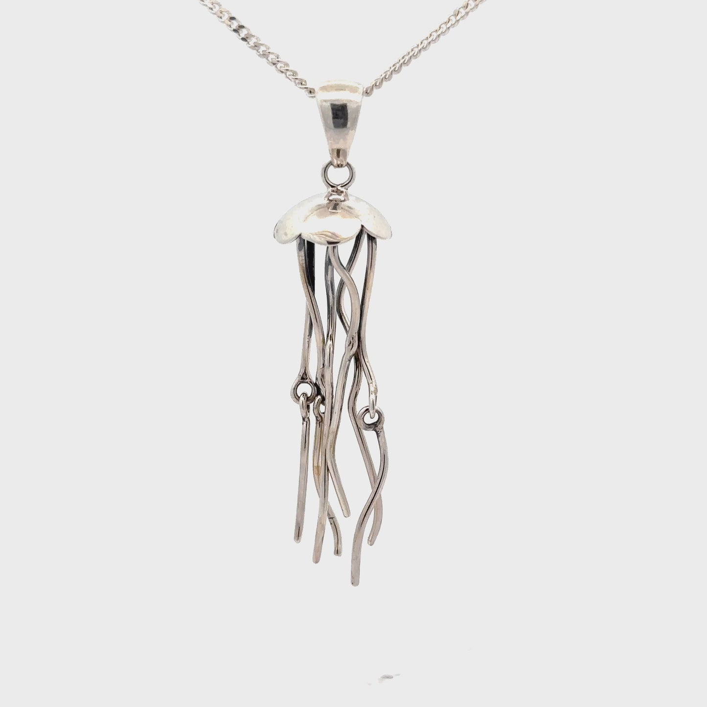 
                  
                    Load and play video in Gallery viewer, Moving Tentacle Jellyfish Pendant
                  
                