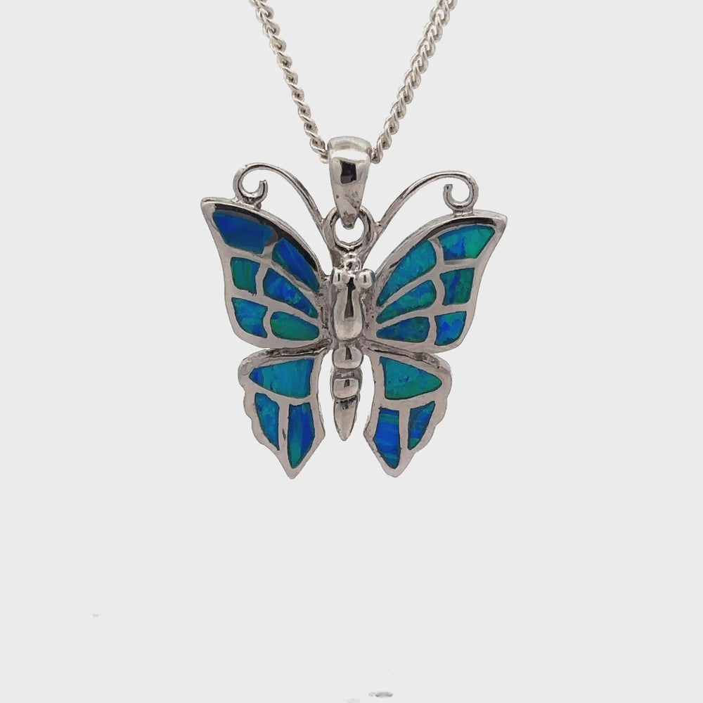 
                  
                    Load and play video in Gallery viewer, Lab-Created Opal Butterfly Pendant
                  
                